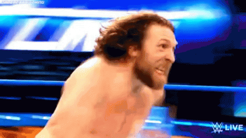 Shirtless Man In Wrestling Ring With W Live Logo GIF