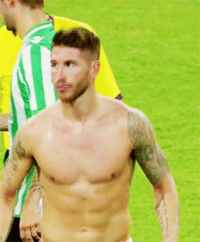 Shirtless Man in Yellow Adidas Shirt