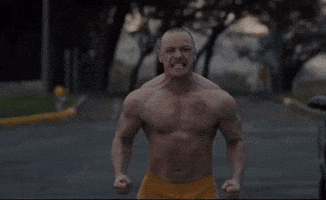 Shirtless Man in Yellow Shorts Running