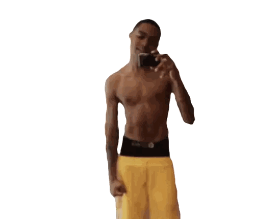 Shirtless Man in Yellow Shorts Taking Selfie