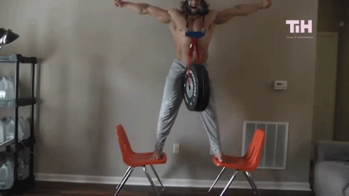 Shirtless Man Jumping Holding Tire With TH GIF