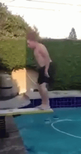 Shirtless Man Jumping Into Pool GIF