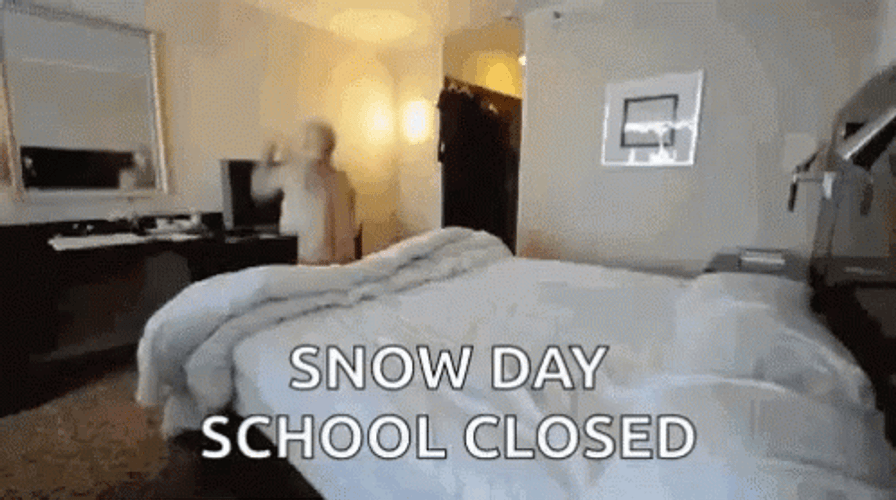 Shirtless Man Jumping On Bed Enjoying Snow Day GIF