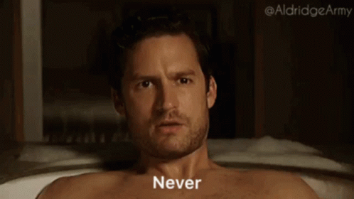 Shirtless Man Laying in Bathtub Saying Never