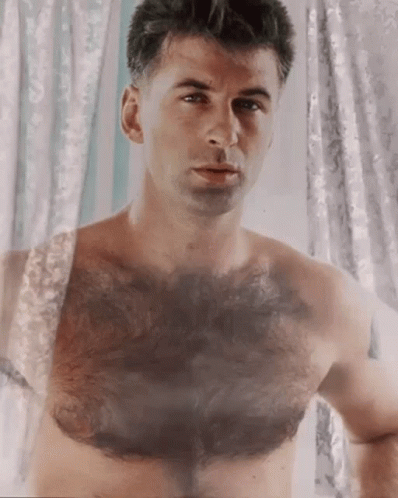 Shirtless Man Looking in Mirror