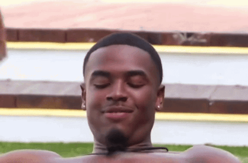 Shirtless Man Lying In Pool Eyes Closed Smiling GIF