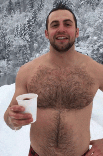 Shirtless Man Lying on Bed with Towel