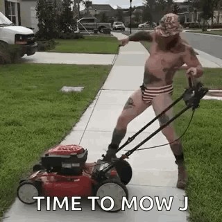 Shirtless Man Mowing Lawn
