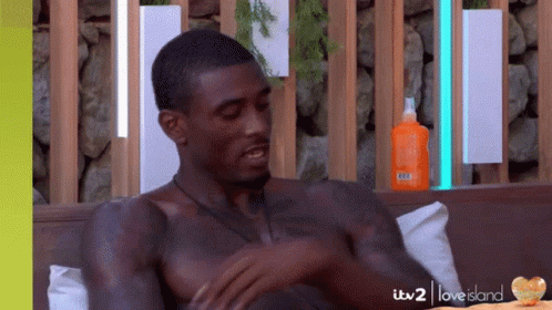 Shirtless Man on Couch With Sunscreen
