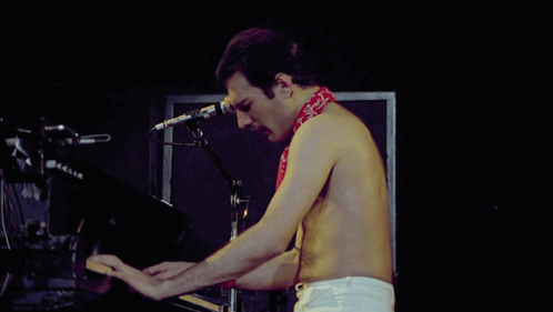 Shirtless Man Playing Piano with Bandana