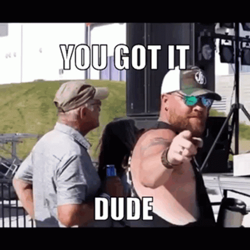 Shirtless Man Pointing at Crowd
