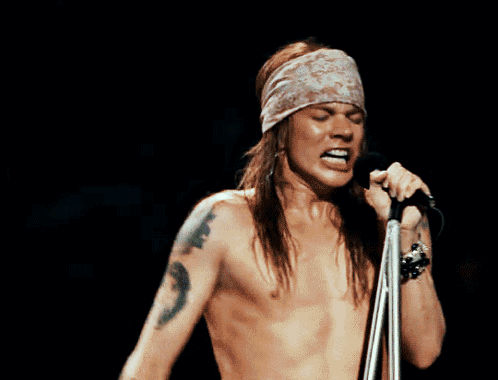 Shirtless Man Singing Into Microphone Mouth Open GIF