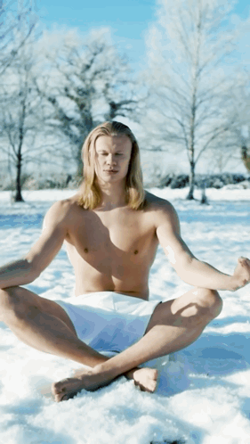 Shirtless Man Sitting Lotus in Snow