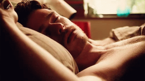 Shirtless Man Sleeping With Arms Outstretched GIF