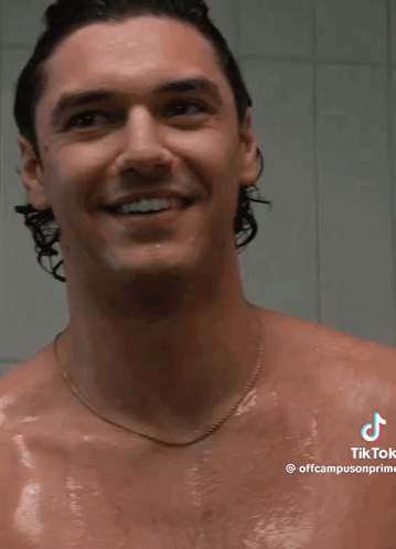 Shirtless Man Smiling in Shower