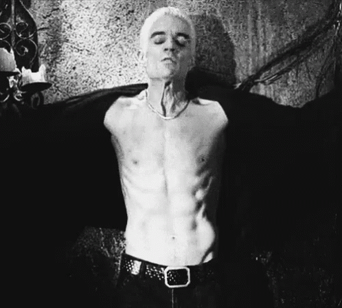 Shirtless Man Standing Arms Outstretched
