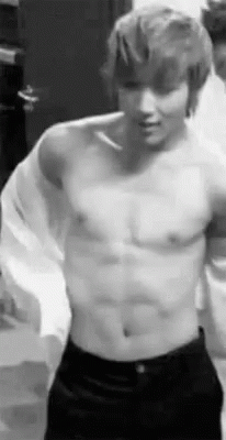 Shirtless Man Standing Arms Outstretched GIF