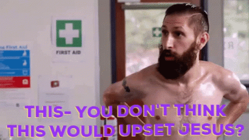 Shirtless Man Standing Before First Aid Sign