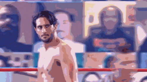 Shirtless Man Standing in Boxing Ring