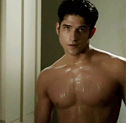 Shirtless Man Standing in Front of Door