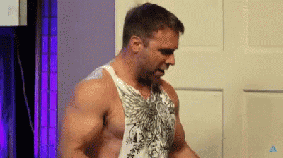 Shirtless Man Standing In Front Of Door GIF