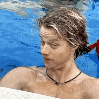Shirtless Man Standing in Swimming Pool