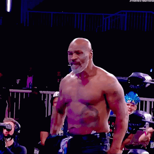 Shirtless Man Standing In Wrestling Ring GIF
