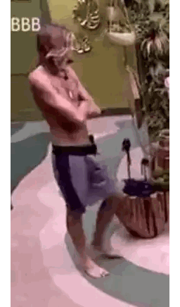 Shirtless Man Standing with Crossed Arms