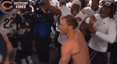 Shirtless Man Surrounded By Players With Number 23 Jerseys GIF