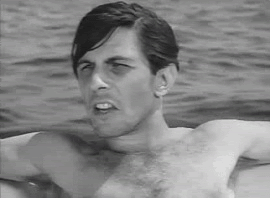 Shirtless Man Swimming and Looking