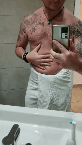 Shirtless Man Taking Bathroom Mirror Selfie
