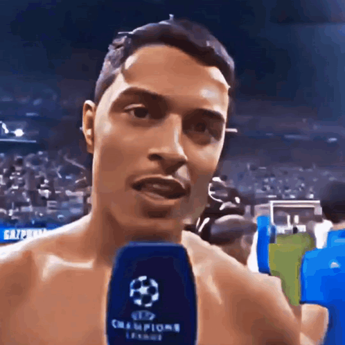 Shirtless Man Talking Into Microphone Champions League