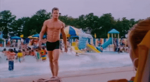 Shirtless Man Walking Water Park