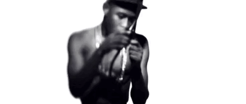 Shirtless Man Wearing Hat and Neck Chain
