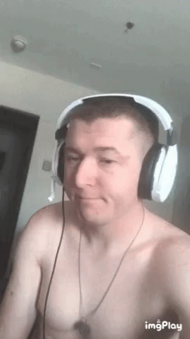 Shirtless Man Wearing Headphones Making Face