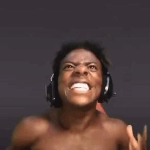 Shirtless Man Wearing Headphones Sitting in Chair