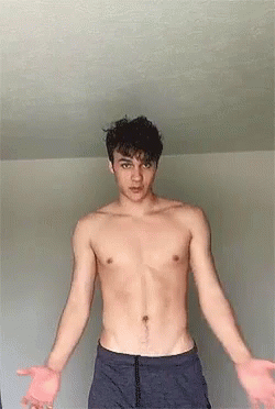 Shirtless Man With Arms Outstretched