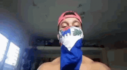 Shirtless Man with Bandana and Hat