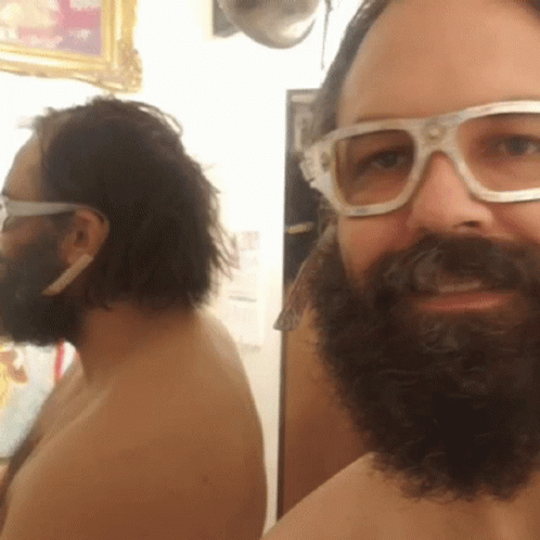 Shirtless Man With Beard and Glasses