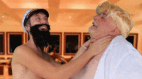 Shirtless Man With Beard Holding Neck