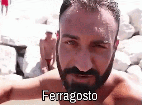 Shirtless Man With Beard In Front Of Rock Wall GIF