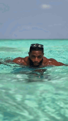 Shirtless Man With Beard Standing in Water