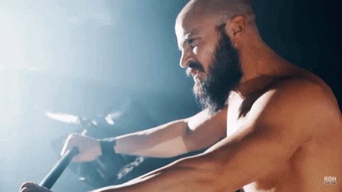 Shirtless Man With Beard Using Rowing Machine ROH