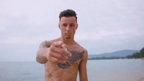 Shirtless Man With Chest Tattoo Holding Up Finger GIF