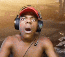 Shirtless Man With Headphones And Red Hat Surprised