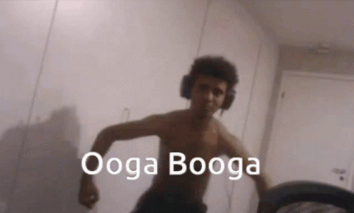 Shirtless Man With Headphones Says Ooga Booga