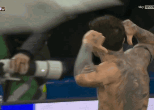 Shirtless Man With Sky Sport Camera