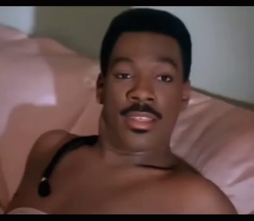 Shirtless Man With Stethoscope Laying on Bed
