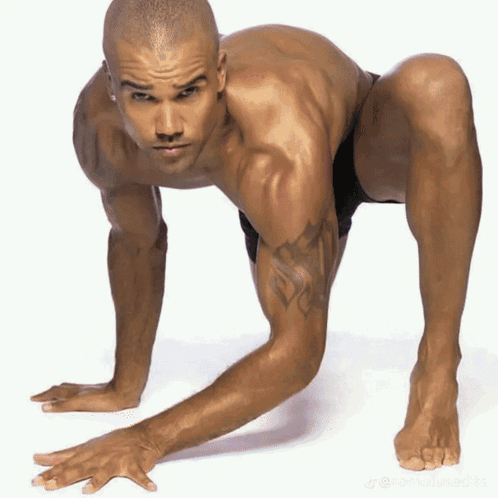 Shirtless Man with Tattoo Crawling
