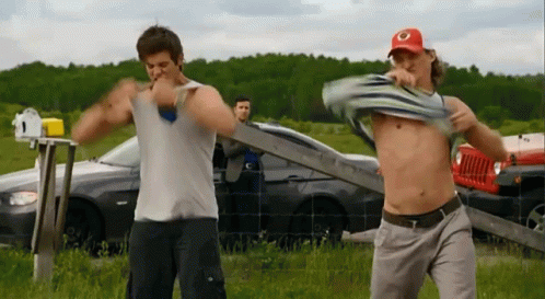 Shirtless Men In Field GIF